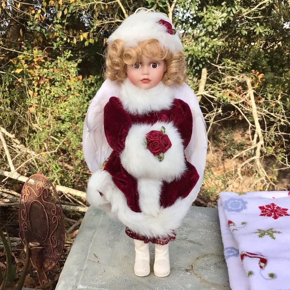Porcelain angel doll w/blonde hair &red dress, approximately 11 inches